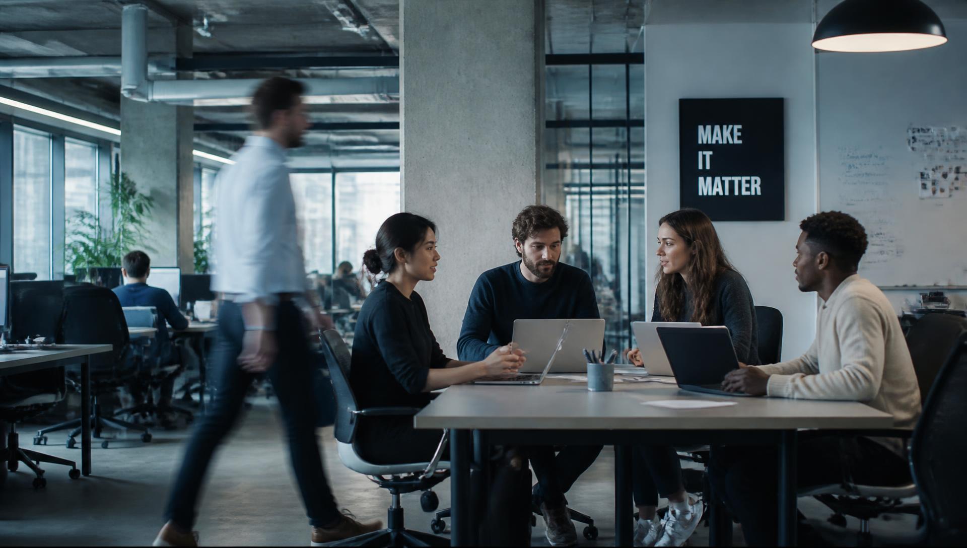 Colleagues collaborating in the Santok Group office